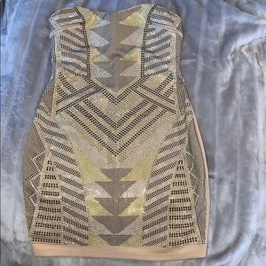 Sequenced black silver and yellow on a nude dress